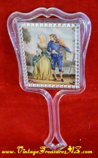 Image for Courting Couple Fragonard-esque Imagery Vintage ca 1950s-1970s Lucite or Acrylic Clear Plastic Hand-Held Vanity Mirror <b><span style='color:red'> ****PRIORITY MAIL SHIPPING INCLUDED – DOMESTIC ORDERS ONLY!***** </span></b><span style='color:purple'>